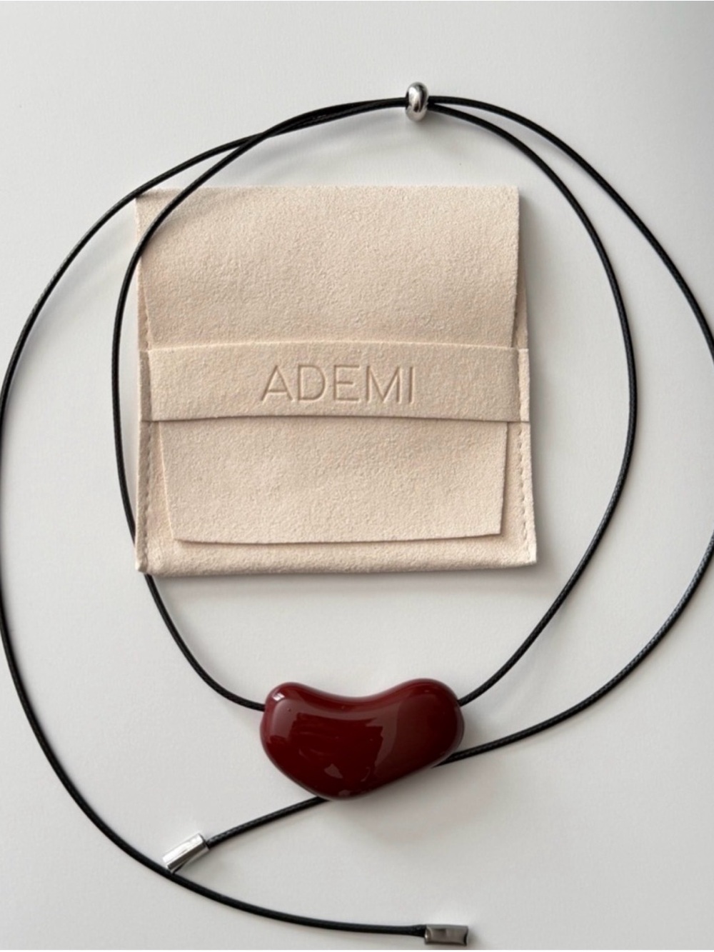 ADEMI Deep Red Glass Heart Pendant on Black Cord